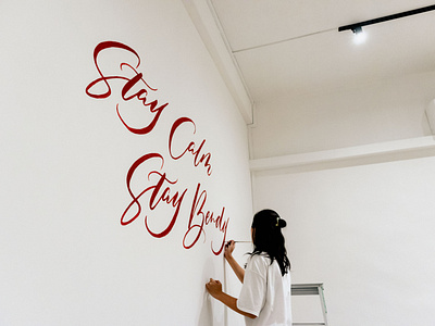 “Stay Calm Stay Bendy” Calligraphy Wall Mural calligraphy and lettering artist calligraphy art calligraphy artist calligraphy design calligraphy mural handlettering lettering mural lettering mural art modern calligraphy mural art mural artist muralist murals script lettering script mural singapore wall painting yoga studio