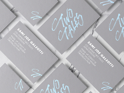 Business card mockup with Two Tales lettering logo