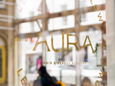 Aura hair & beauty academy window graphics academy beauty brand branding cling design display gold graphic design hair identity logo reflections salon shop sign writing signage typography window