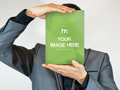 Businessman Holding Hardcover Book In Front Of Face book book mockup hardcover book mediamodifier mockup mockup generator online mockups psd mockup