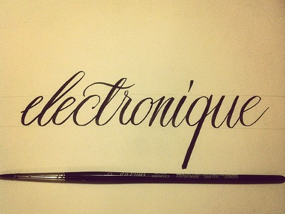 Electronique black brush calligraphy lettering logo
