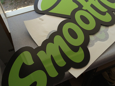 Smootheees brand green logo signage