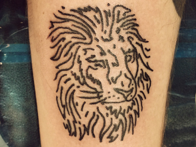 DeRossett lion tattoo