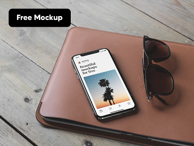 Free iPhone Mockup laying on top of MacBook Air air free iphone leather macbook macbookair mockup old sleve sunglasses table vintage