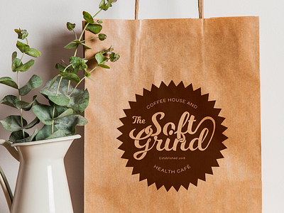 The Soft Grind logo - mock-up on paper bag