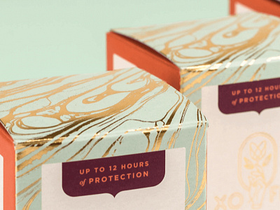 XO Flo - Packaging Detail flower gold foil hand menstrual cup packaging tulip xo