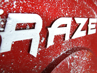 RAZE Logo on a Cast Iron Weight Plate