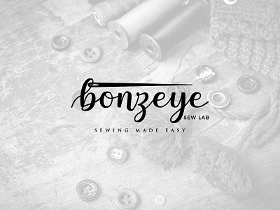 Bonzeye black and white bonzeye creative design handwriting icon logo logo design sew sewing vector wordmark logo