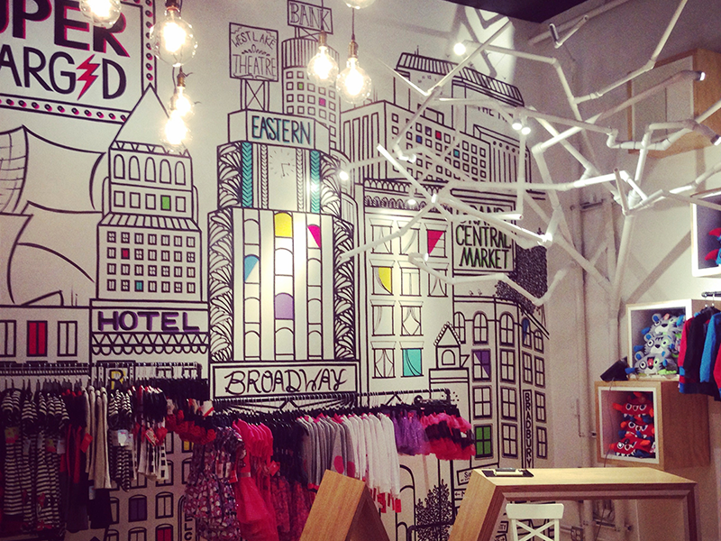 Supercharged graphic art retail interior design illustration mural apparel childrens store kids pop up boutique clothing