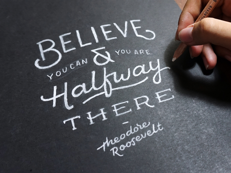 Believe black paper white pencil hand lettering typography