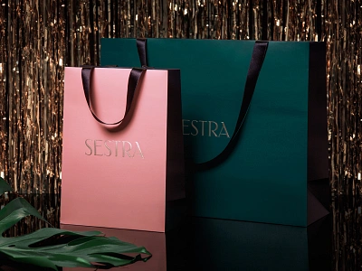 Sestra store shopping bags 70s 80s disco fashion gold lettering monstera packaging sestra shop store typography