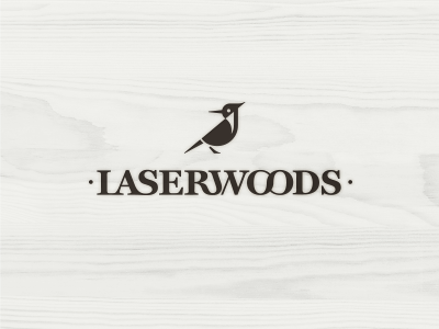 Laserwoods animal beak bird black custom type identity laser lettering logo type wood woodpecker