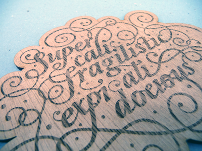 Supercailfragilisticexpialidocious tactile typography wood