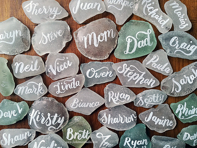 Hand lettered names onto sea glass for wedding place cards hand drawn hand lettering lettering wedding wedding stationery