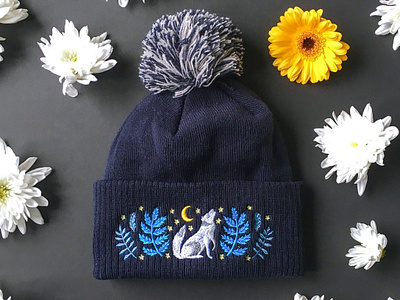 Celestial Call Wolf Bobble Hat animal animals beanie botanical design drawing embroidered hat embroidery floral hat illustration moon nature winter hat wolf wooly hat