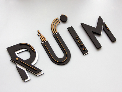 Ruim 3d geometric hand made identity laser cut lettering logo papercraft space type typography wood