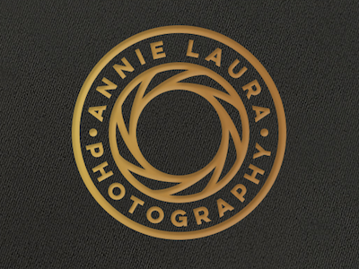 Annie Laura Photography badge black circle gold lens logo minimal photography