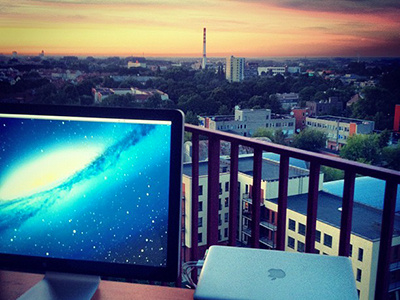 Workspace balcony cinema display evening klaipeda lithuania macbook setup sky summer workplace apple workspace