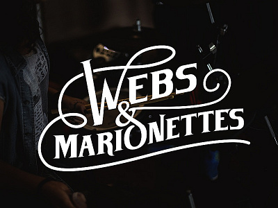 Webs & Marionettes Logo