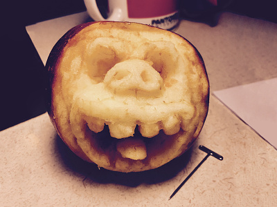 Carved Face in Apple apple carving different medium fruit illustration