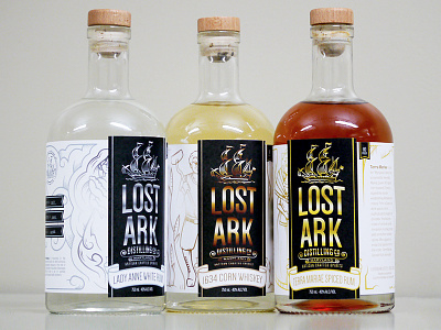 Lost Ark Distilling Bottles alcohol ark boat bronze foil gold packaging rum silver spiced whiskey white