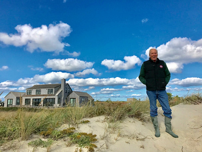 Happy client on the dunes in front of his new home ack beach beach cottage cape cottage miacomet modern shack nantucket new england