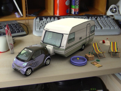 smart car and caravan 3d comp onto photo