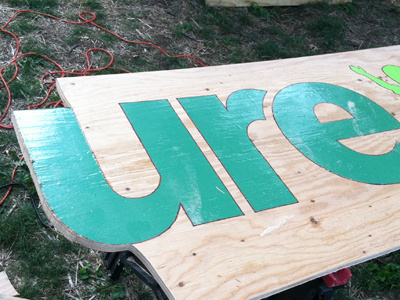 CURE event booth sign construction cure.org green handmade lime physical sign wood