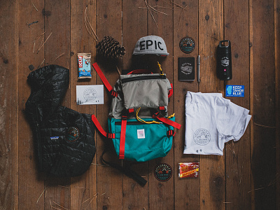 The Epicurrence Welcome Pack backpack card epic hat jacket logo patagonia patch pinecone sticker thermos tshirt