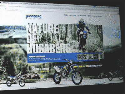 Husaberg.com background image dirt bike feature image field homepage interface motor motorcycle mud navigation outdoors scroll tires ui website