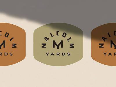 Malcolm Yards badge brand branding burnt orange graphic design green heritage industrial logo malcolm monogram olive green orange vintage yards