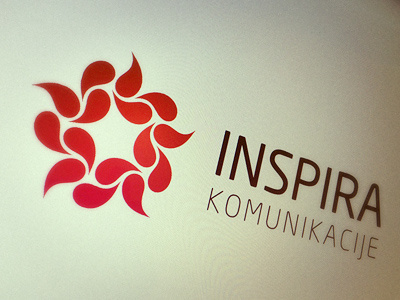 Inspira Communication Logo (screen photo) communication connected flower inspiration logo red