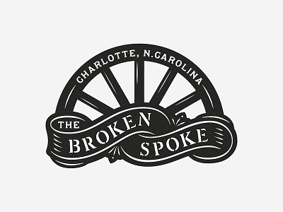 The Broken Spoke broken spoke logo sign stencil wagon wheel