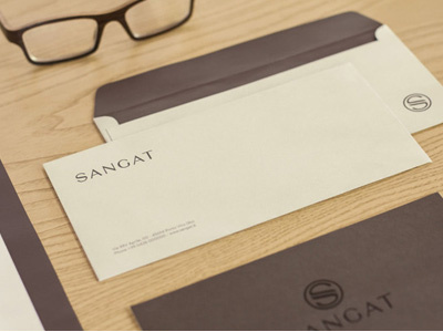 Photo of Stationery | Sangat | Wellness Centre and Spa brand business card envelope invitation letterhead logo design print design sangat spa stamp stationery wellness