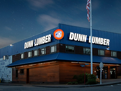 Dunn Lumber Flagship Store backlit exterior design light logo mascot night sign signage sky stars store exterior