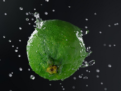 Green lemon into the water splash in slow motion