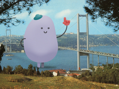 Attack of the Giant Friendly JellyBean bridge cars giant hat jellybean ocean pointing sky smile trees vintage water