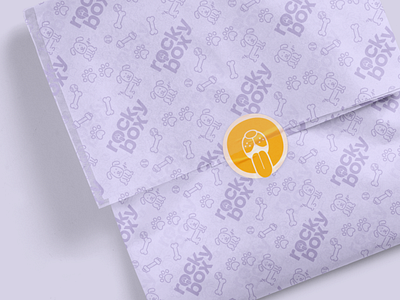 Branded wrapping paper brand identity branded branding branding and identity dog dog logo most most studios pattern pet rockybox service sticker wrapp wrapping paper