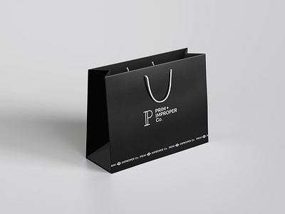 Prim + Improper | Shopping Bag bag bold brand identity branding design lettermark logo logodesign mark minimal minimalism mockup modern monogram shop shopping shopping bag startup typography visual identity