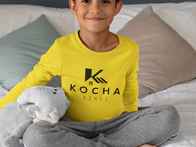long-sleeve-tee-mockup-featuring-a-kid-sitting-on-a-bed-by-a-stuffed-elephant-31650.png