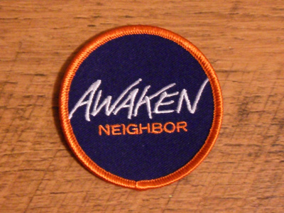 Awaken Neighbor Patch custom font logo orange patch purple thread trade gothic extended type typography white