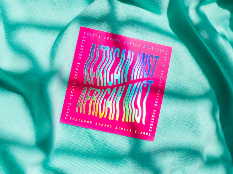 African Mist distorted type sticker foil holographic lettering african mist