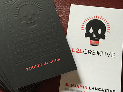 L2L Business Cards branding business cards collateral deboss emboss identity lightbulb logo luck printing skull