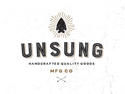 Unsung Mfg Co arrowhead branding distressed gold identity logo texture typography vintage