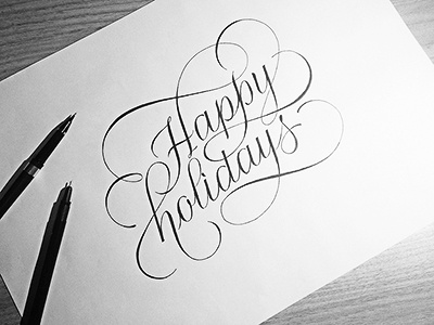 Happy holidays black calligraphy greetings happy holidays ink lettering letters white