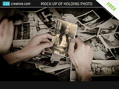 Free Mock-up of a guy holding Old Photo