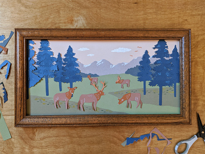 Cut paper elk mountain scene