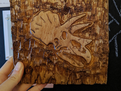 Triceratops skull wood carving