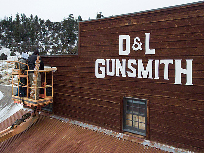 D&L Gunsmith Signage colorado firearms guns gunsmith handguns mountains old west town signage snow typography western wood letters