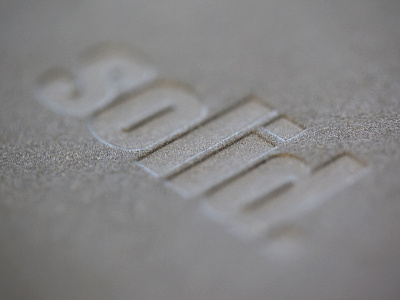 Solid. concrete deboss duplex gmund grey letterpress punch solid